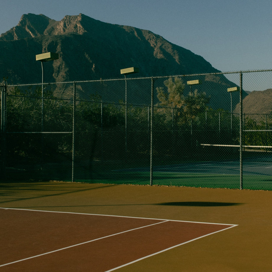Tennis courts with mountains in the background