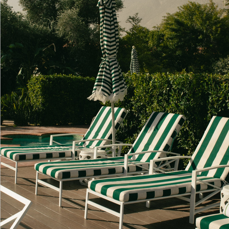 Poolside lounge chairs and umbrellas